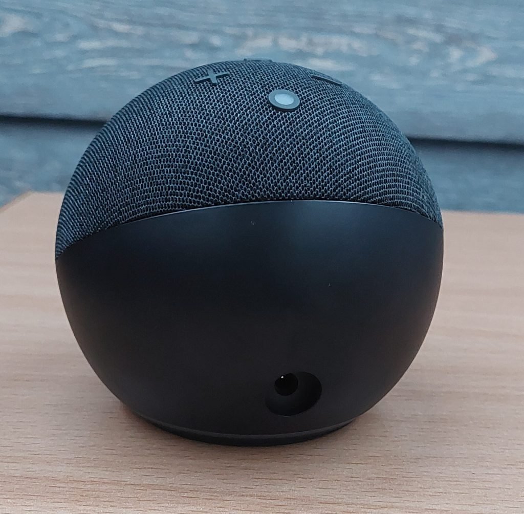 Amazon Echo Dot fifth generation on a wooden table