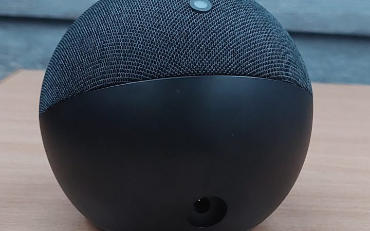 Amazon Echo Dot fifth generation on a wooden table