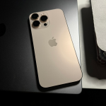 Apple iPhone 16 Pro Max in Desert Titanium, rear view