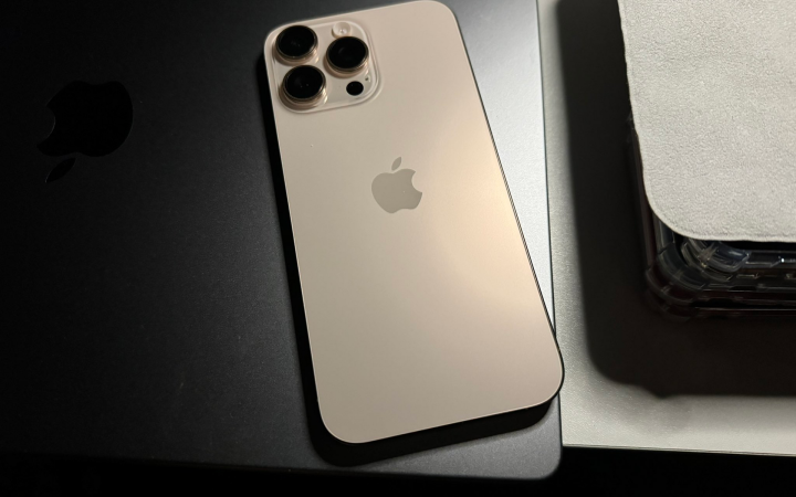 Apple iPhone 16 Pro Max in Desert Titanium, rear view