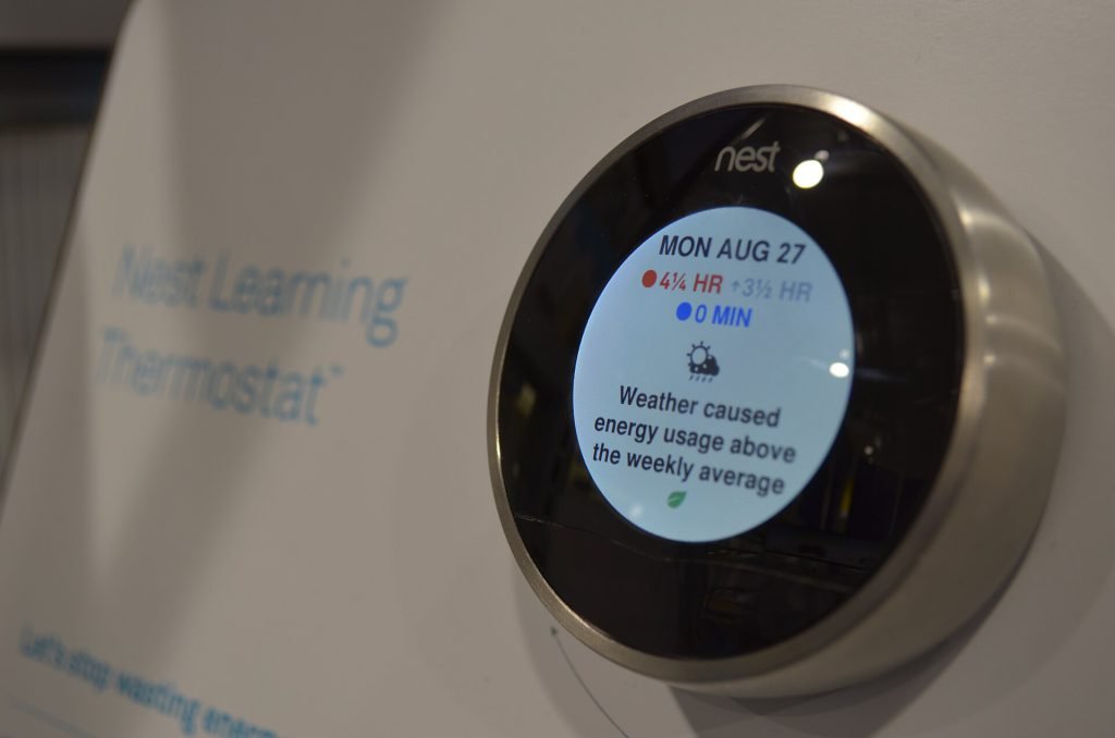 Google Nest Learning Thermostat on a wall display