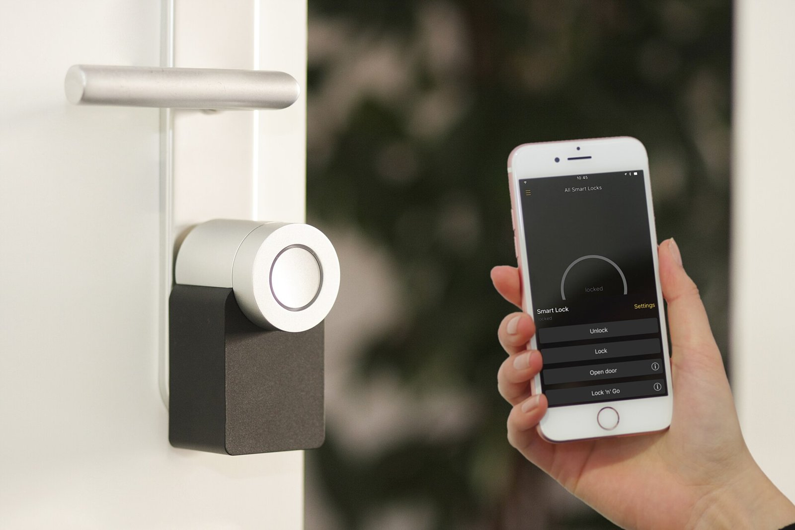 Nuki smart lock on a door with a phone app