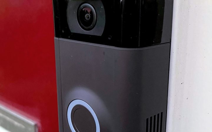 Ring video doorbell installed next to a door