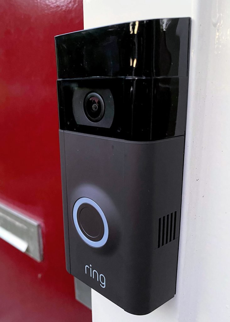 Ring video doorbell installed next to a door